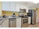 Well-equipped kitchen featuring granite countertops and stainless steel appliances at 2007 S Ocean Blvd. # 1403, Myrtle Beach, SC 29577