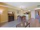 Open-concept living area with dining table, TV, and kitchen view offering a comfortable and convenient living experience at 2007 S Ocean Blvd. # 1403, Myrtle Beach, SC 29577