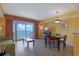 Cozy living and dining area with a view of the ocean; includes dining table and access to balcony with nice ocean view at 2007 S Ocean Blvd. # 1403, Myrtle Beach, SC 29577