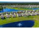 Aerial view of community with a lake and manicured lawns. Highlighted home location at 2106 Ainsley Dr., Little River, SC 29566