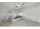 Cozy bedroom featuring a bunk bed, a ceiling fan, and a window looking out to the neighborhood at 2106 Ainsley Dr., Little River, SC 29566