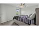 Comfortable bedroom with a view of the pond and a bed with striped bedding at 2106 Ainsley Dr., Little River, SC 29566