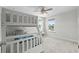Bright bedroom featuring a bunk bed, ceiling fan, and a view to the outdoors from the window at 2106 Ainsley Dr., Little River, SC 29566