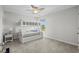 Bedroom featuring a bunk bed, ceiling fan, and a window looking out to the neighborhood at 2106 Ainsley Dr., Little River, SC 29566