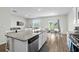 Open concept kitchen with a large island, stainless steel appliances, and plenty of counter space at 2106 Ainsley Dr., Little River, SC 29566