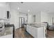 Spacious kitchen features a large island with seating, modern appliances, and granite countertops at 2106 Ainsley Dr., Little River, SC 29566