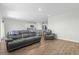 Spacious living area open to the kitchen, featuring hardwood floors and comfortable leather seating at 2106 Ainsley Dr., Little River, SC 29566