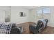 Cozy living room with leather recliners, a mounted TV, and a window providing natural light at 2106 Ainsley Dr., Little River, SC 29566
