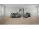 Open-concept living room featuring gray sofas, a neutral color scheme, and carpeted floors at 2106 Ainsley Dr., Little River, SC 29566