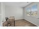 Bright office space with modern desk and a window offering natural light and neighborhood views at 2106 Ainsley Dr., Little River, SC 29566