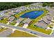 Aerial view showing manicured lawns, lake views, and a serene residential neighborhood with well-spaced homes at 215 Kendrick St., Little River, SC 29566