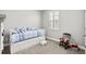 Day bed with pull-out drawers, sunny window and playful decor in this bedroom at 215 Kendrick St., Little River, SC 29566