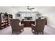 Home office with a ceiling fan, carpeted floors, a large desk, chairs and built-in bookcases at 215 Kendrick St., Little River, SC 29566
