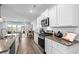 Modern kitchen with granite countertops, stainless appliances, and views of the living area and lake, great for entertaining at 215 Kendrick St., Little River, SC 29566