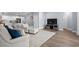 Inviting living room with stylish furniture and a seamless view into the adjacent kitchen area at 215 Kendrick St., Little River, SC 29566