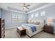 Serene main bedroom featuring tray ceilings, neutral tones, and a charming window seat with views at 215 Kendrick St., Little River, SC 29566