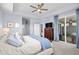 Inviting main bedroom with direct access to an outdoor patio, complemented by neutral colors and views at 215 Kendrick St., Little River, SC 29566