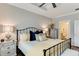Inviting bedroom features a comfortable bed with yellow accents, complemented by stylish nightstands and natural light at 215 Vivian St. Nw # 215, Calabash, NC 28467
