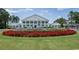 Exterior view of the clubhouse showcasing the manicured landscaping and the fountain at 215 Vivian St. Nw # 215, Calabash, NC 28467