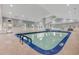 Bright indoor pool with lots of natural light, exit door, and visible depth markings at 215 Vivian St. Nw # 215, Calabash, NC 28467