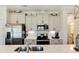 Modern kitchen featuring stainless steel appliances, granite countertops, and ample cabinet space at 215 Vivian St. Nw # 215, Calabash, NC 28467