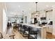 Open-concept kitchen with a spacious island, modern appliances, and seamless flow to the dining area at 215 Vivian St. Nw # 215, Calabash, NC 28467