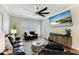 Comfortable living room featuring hardwood floors, a ceiling fan, and a mounted TV for entertainment at 215 Vivian St. Nw # 215, Calabash, NC 28467