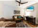 Comfortable living room features stylish leather furniture, ceiling fan, and modern decor for a cozy atmosphere at 215 Vivian St. Nw # 215, Calabash, NC 28467