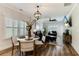 Inviting dining area flowing into a stylish living room with hardwood floors and ample natural light at 215 Vivian St. Nw # 215, Calabash, NC 28467