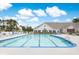 Outdoor pool with plenty of chairs, tables and umbrellas for residents to relax and enjoy at 215 Vivian St. Nw # 215, Calabash, NC 28467