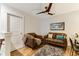 Cozy sitting area with leather furniture, a ceiling fan, and a comfortable rug creating a relaxing space at 215 Vivian St. Nw # 215, Calabash, NC 28467
