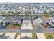 Aerial view of a coastal neighborhood showcasing waterfront homes and a relaxed community setting at 25 Newport St., Ocean Isle Beach, NC 28469