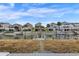 Scenic view of waterfront homes with private docks, creating a picturesque and desirable neighborhood setting at 25 Newport St., Ocean Isle Beach, NC 28469