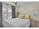 Cozy bedroom featuring stylish furnishings, a dresser, and bright windows with shades and curtains at 25 Newport St., Ocean Isle Beach, NC 28469