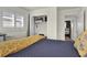 Comfortable bedroom featuring stylish furnishings, a closet, and a bright window with shutters at 25 Newport St., Ocean Isle Beach, NC 28469