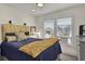 Inviting bedroom showcasing a comfortable bed, stylish furnishings, and a bright window with views at 25 Newport St., Ocean Isle Beach, NC 28469