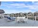 A spacious deck with lounge chairs and dining area offering waterfront views for outdoor enjoyment at 25 Newport St., Ocean Isle Beach, NC 28469
