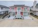 Charming raised beach home with a garage and parking underneath, offering a relaxed coastal lifestyle at 25 Newport St., Ocean Isle Beach, NC 28469