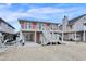 Inviting raised beach home featuring white stairs, a covered parking area, and coastal charm at 25 Newport St., Ocean Isle Beach, NC 28469