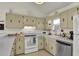 Classic kitchen featuring stainless steel appliances, white countertops, and timeless design at 25 Newport St., Ocean Isle Beach, NC 28469