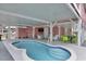 Outdoor pool surrounded by seating and a covered area, perfect for entertaining and relaxation at 25 Newport St., Ocean Isle Beach, NC 28469