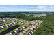 Expansive aerial view of a residential community nestled amidst lush greenery and serene ponds at 2709 Eton St., Myrtle Beach, SC 29579