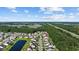 Expansive aerial view of a residential community nestled amidst lush greenery and serene ponds at 2709 Eton St., Myrtle Beach, SC 29579
