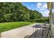 Spacious backyard with lush lawn, mature trees, and outdoor seating area at 2709 Eton St., Myrtle Beach, SC 29579