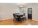 Cozy dining area with a dark wood table, seating for four, and natural light at 2709 Eton St., Myrtle Beach, SC 29579