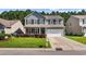 Charming two-story home boasts a well-manicured lawn, complemented by a two-car garage and inviting front porch at 2709 Eton St., Myrtle Beach, SC 29579