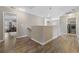 Upstairs hallway showcasing hardwood floors and access to various rooms at 2709 Eton St., Myrtle Beach, SC 29579