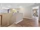 Upstairs hallway showcasing hardwood floors and access to various rooms at 2709 Eton St., Myrtle Beach, SC 29579