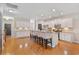 Spacious, open-concept kitchen featuring white cabinetry, granite countertops, and an island with bar stools at 2709 Eton St., Myrtle Beach, SC 29579