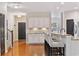 Open kitchen featuring white cabinets, granite countertops, and a breakfast bar area at 2709 Eton St., Myrtle Beach, SC 29579